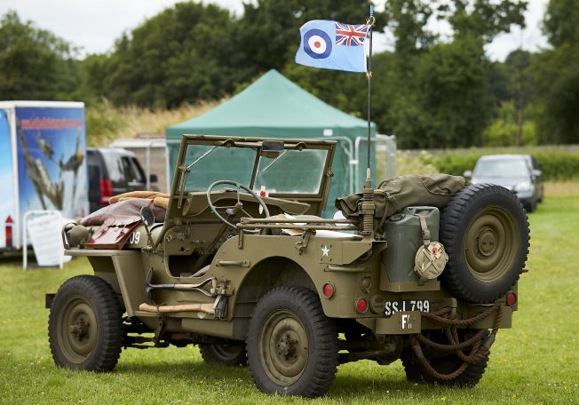 An old World War Two military jeep sits parked on Kenley